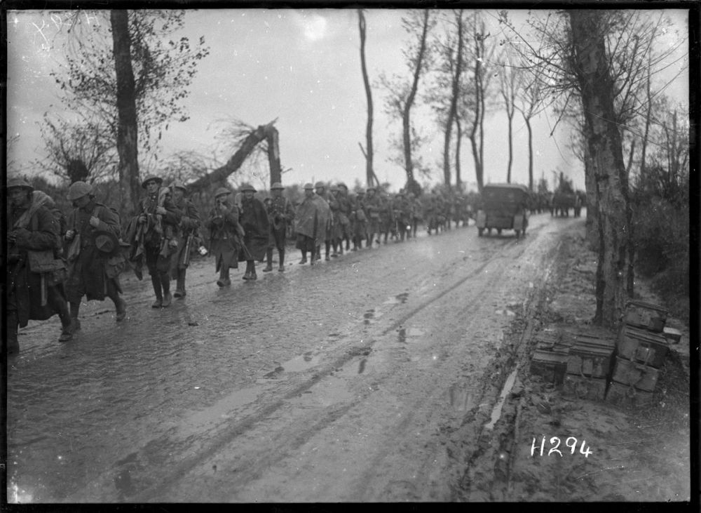 New Zealand soldiers march along the road on their way to the firing line in the St Jean sector, Ypres Salient, 11 October 1918.